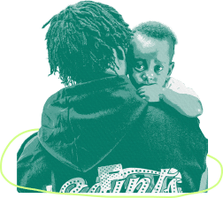 A dad in a hoodie holds a baby with curly hair.